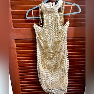 Racer neck dress with gold pearl chains